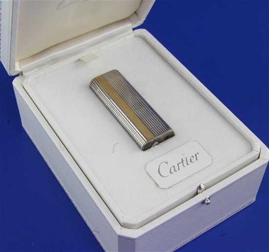 A 1970s Cartier parcel gilt silver limited edition commemorative QEII Silver Jubilee gas lighter in box